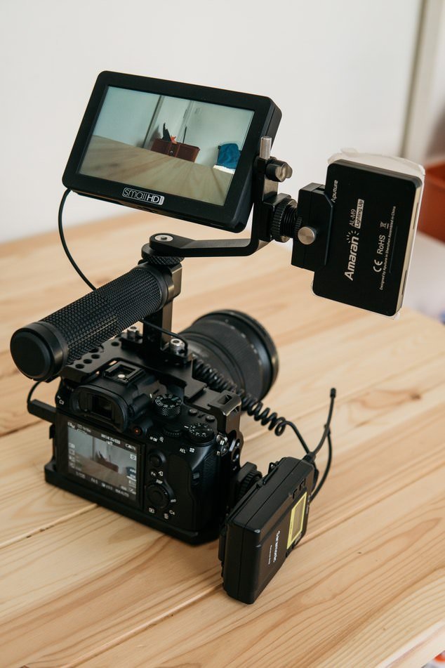 image showing a dslr camera on a wooden table