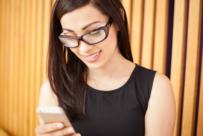 Spencer Cobby's lifestyle product photography for Eyewear Accessories depicting a woman wearing anti-allergy glasses whilst looking at her phone