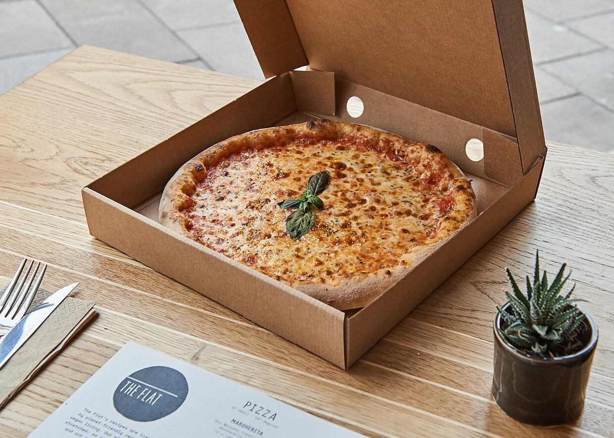 image showing Spencer Cobby photography of a pizza in a takeaway box from The Flat